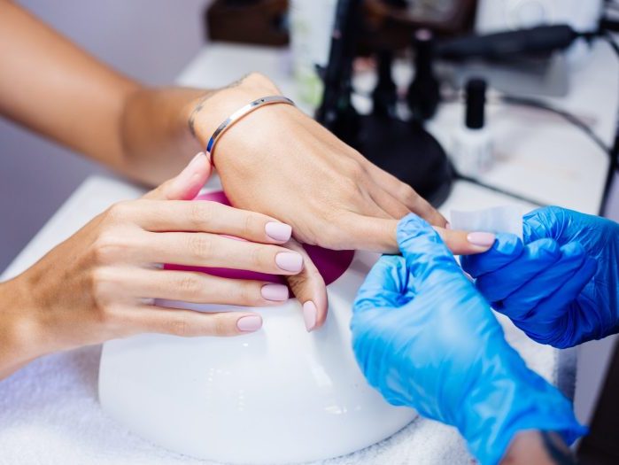 beautiful female hands finger nail treatment making process professional nail file drill action beauty hand care concept scaled e1739968200625