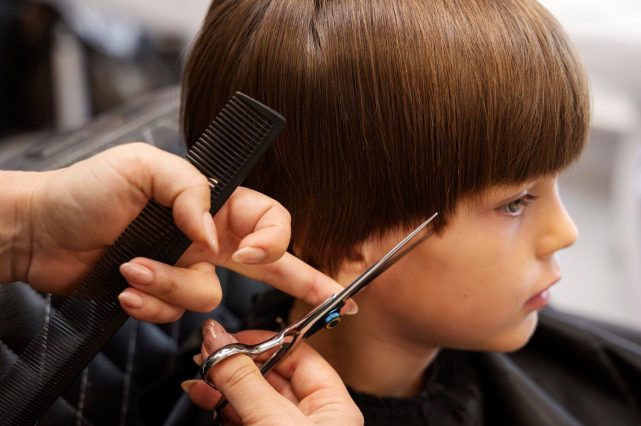 side view kid getting haircut salon_23 2149870367 e1740466922737